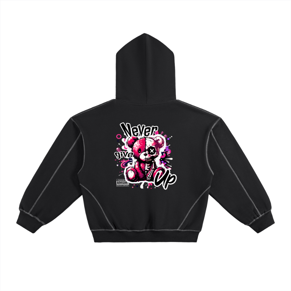 Black contrast-stitched boxy hoodie with large back graphic featuring a split-tone teddy bear with ‘Never Give Up’ lettering.