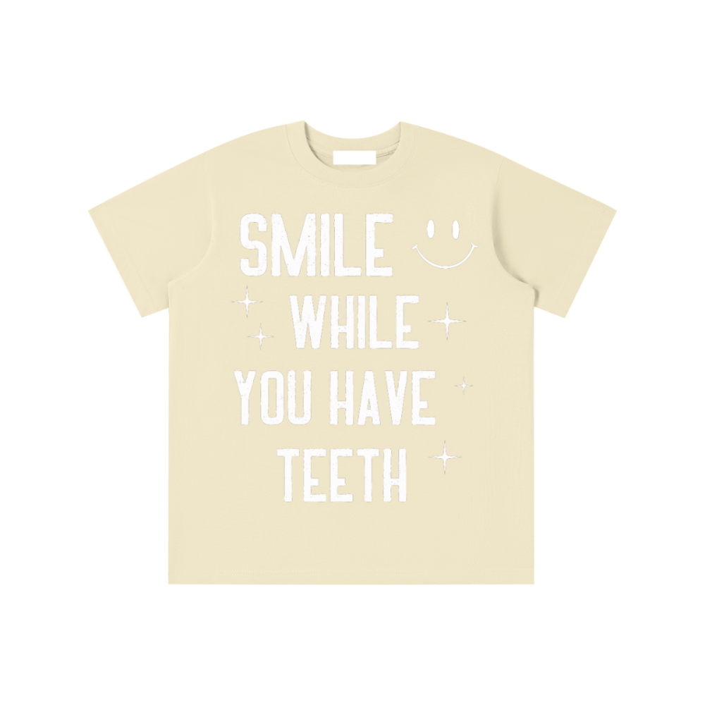 Essential Kids' T-shirt - Gooso Pixel-smile-while-you-have-teeth-yellow