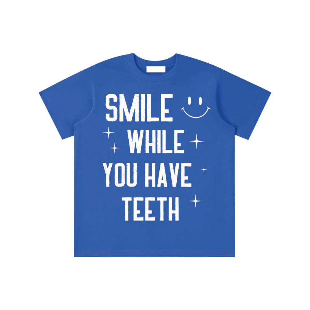 Essential Kids' T-shirt - Gooso Pixel smile while you have teeth royal blue 